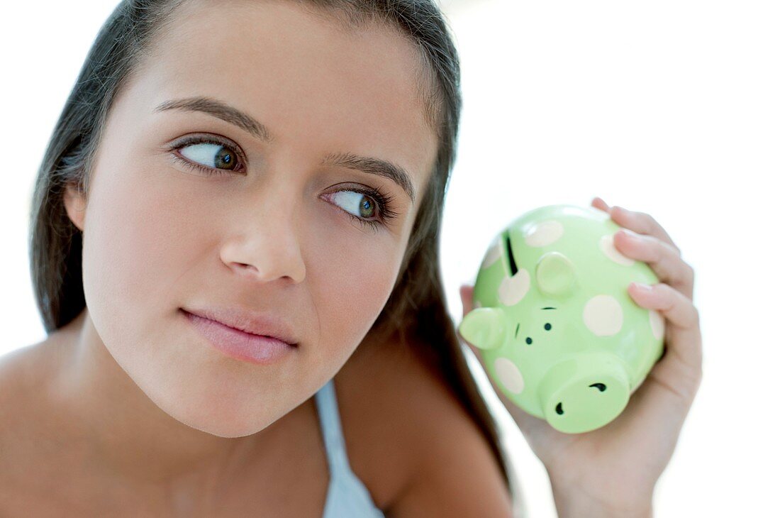 Teenage girl saving money