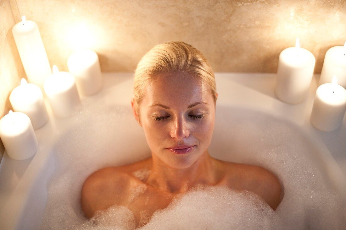 Woman relaxing in a bath