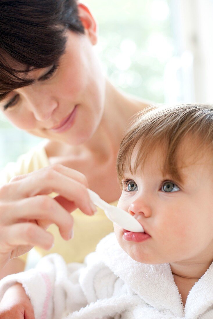 Toddler taking medicine