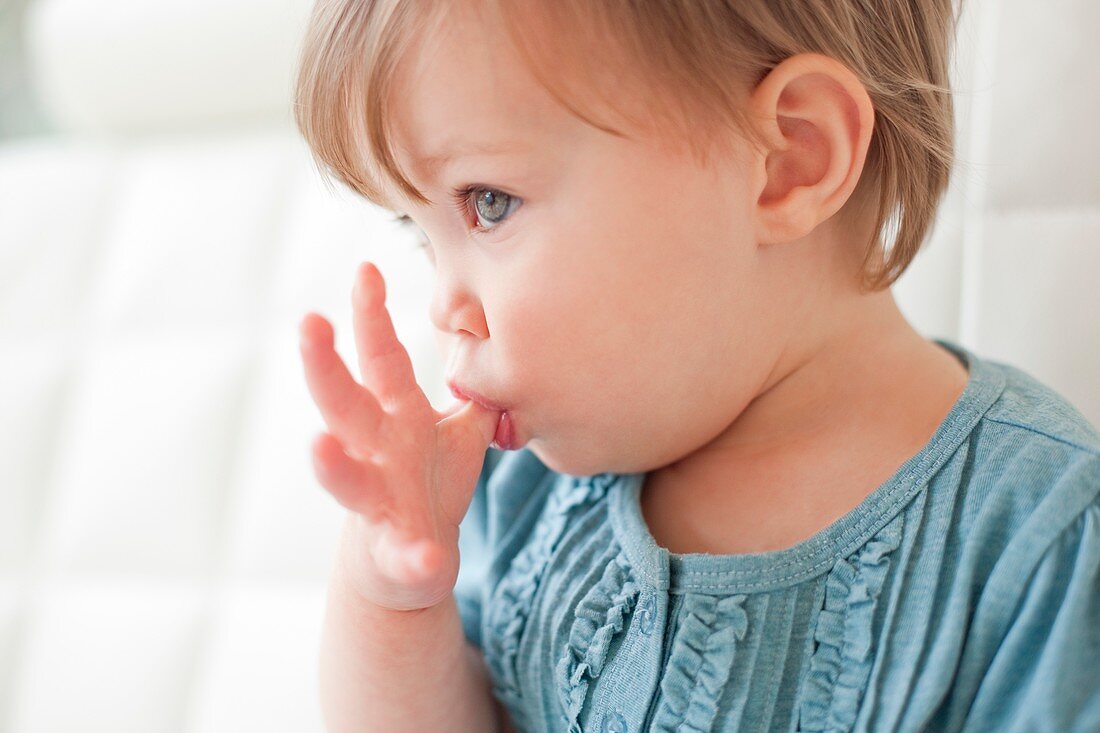 Toddler sucking her thumb