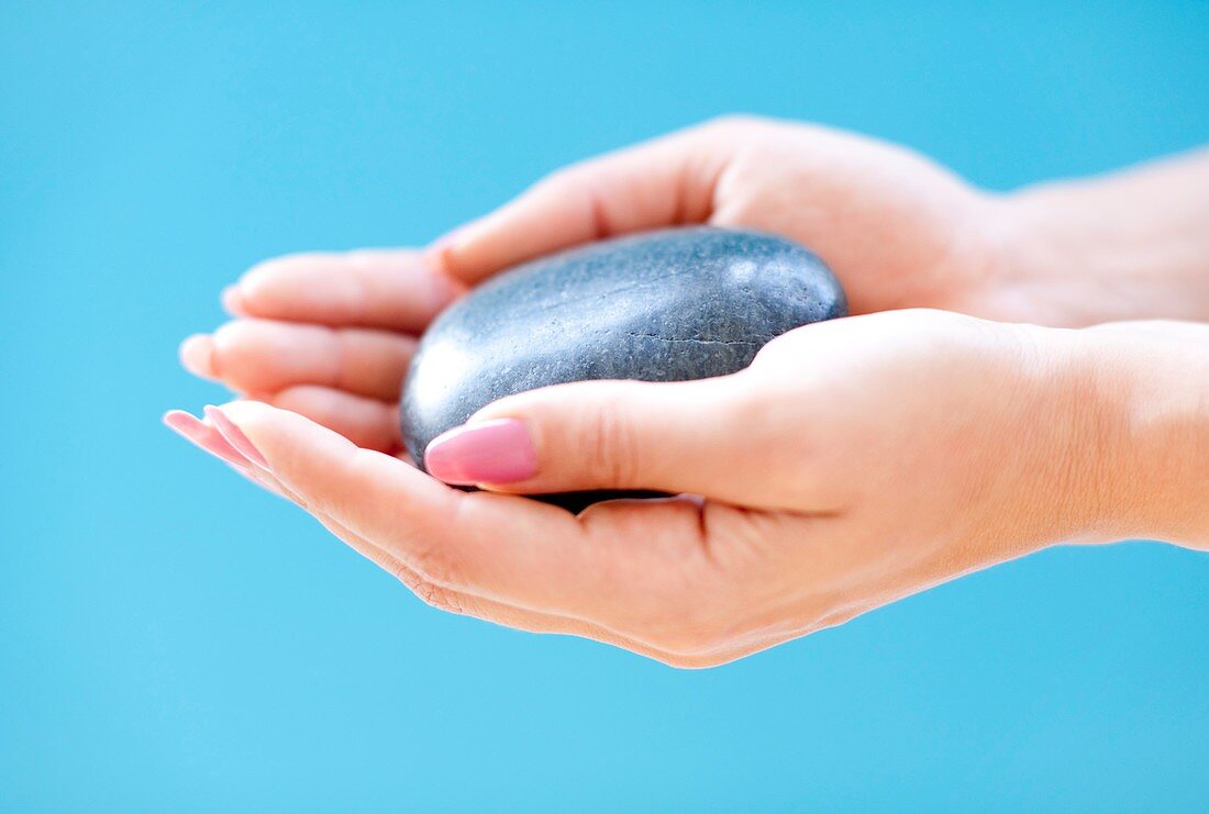 Stone in a woman's hand