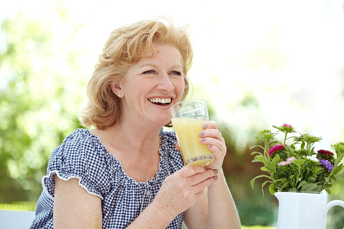 Woman drinking fruit juice
