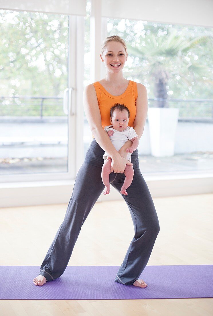 Mother and baby doing yoga