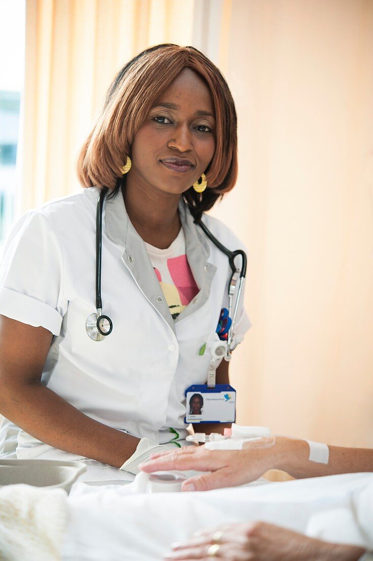 Nurse preparing a patient for an IV line