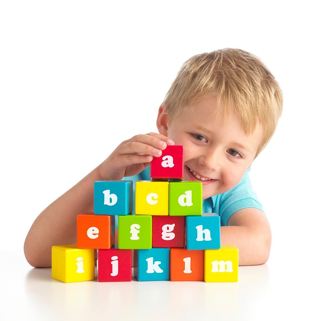 Boy playing with alphabet blocks