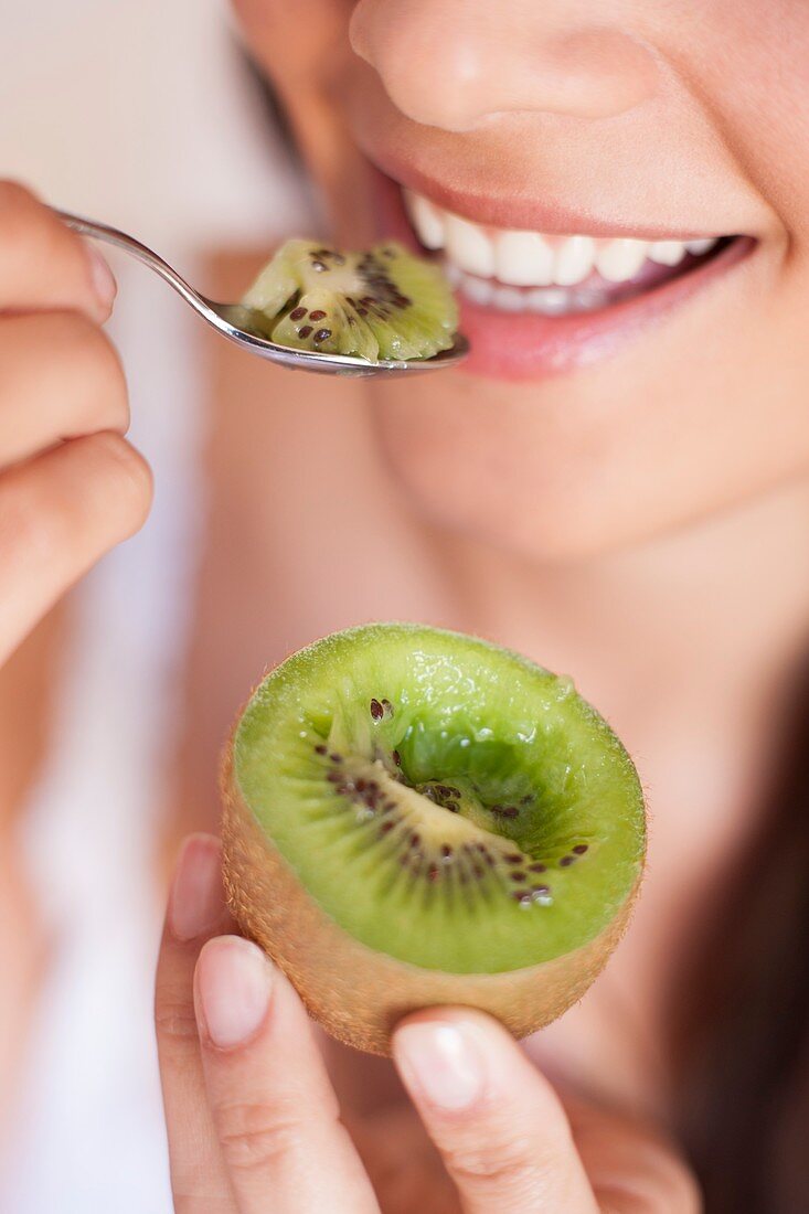 Woman eating fruit