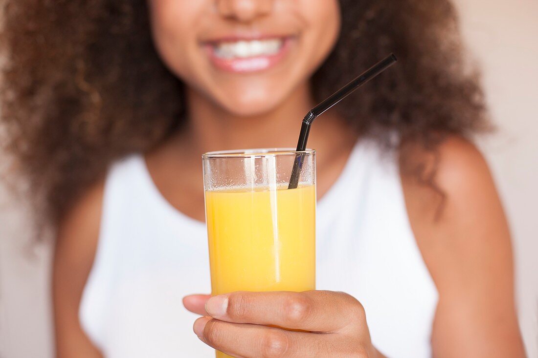 Teenage girl with fruit juice
