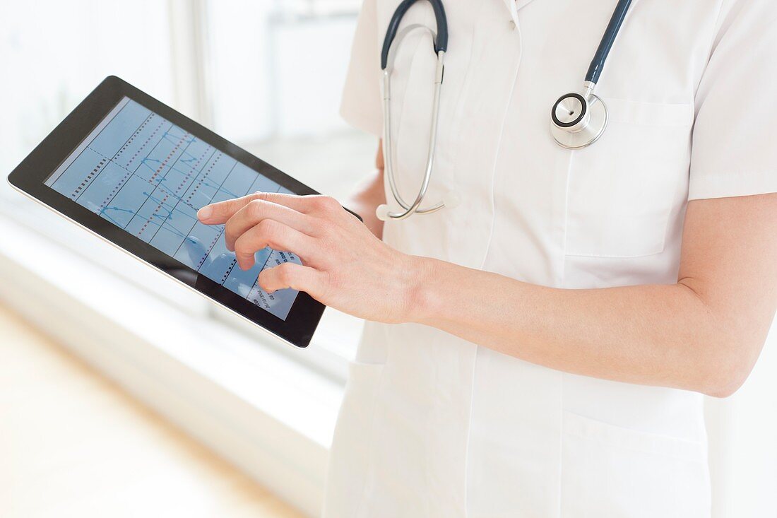Nurse using a tablet computer
