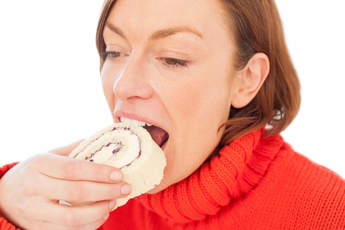 Woman eating cake