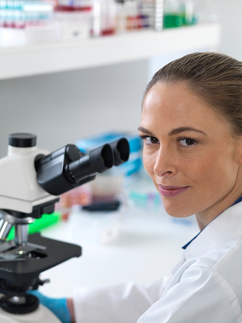 Scientist with microscope