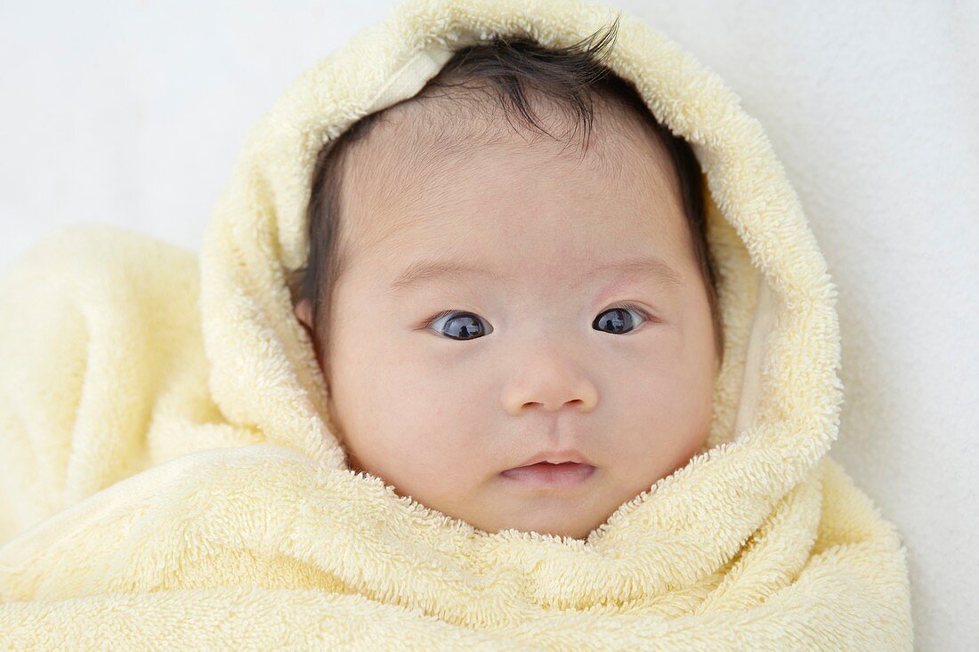 Baby girl wrapped in towel