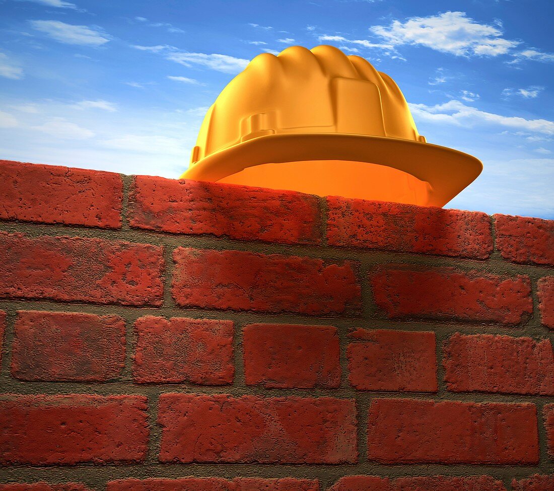 Hard hat on a brick wall,artwork