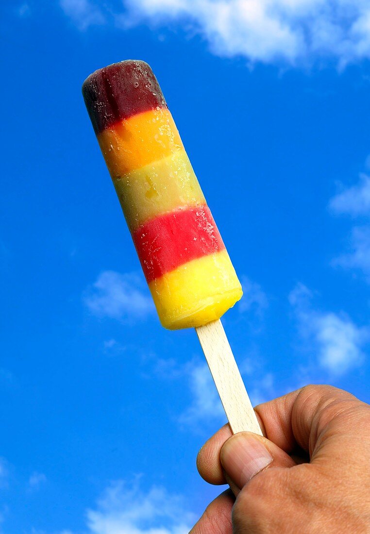 Person holding ice lolly