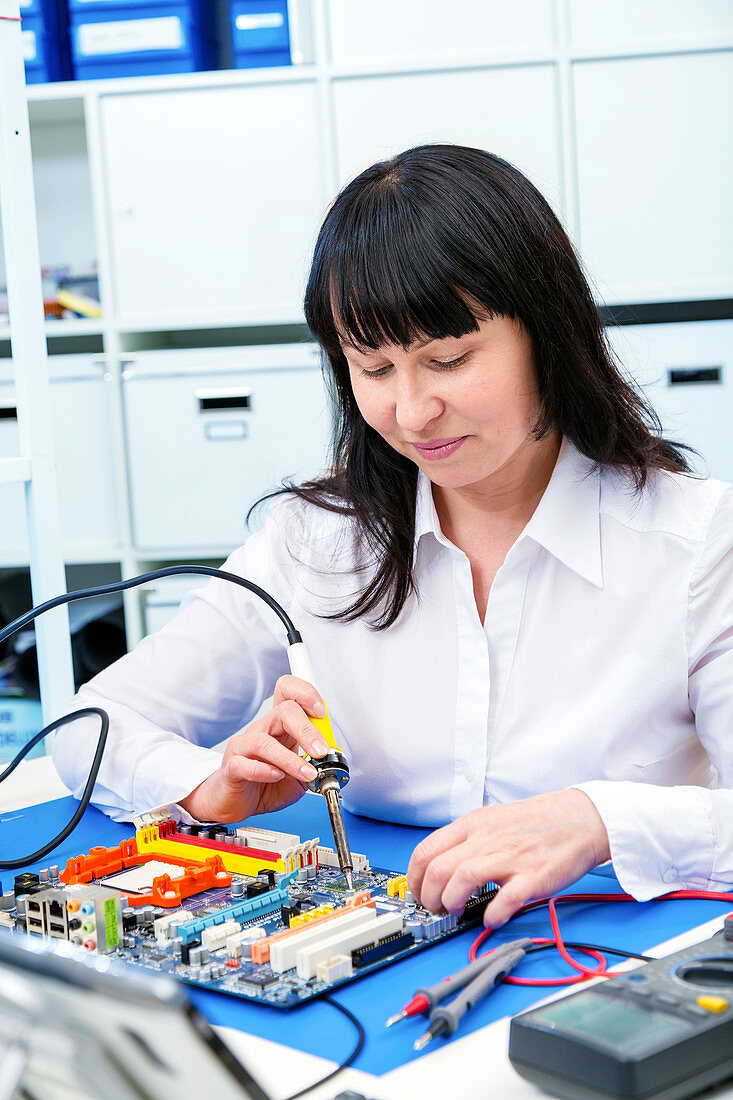 Woman making a micro processor