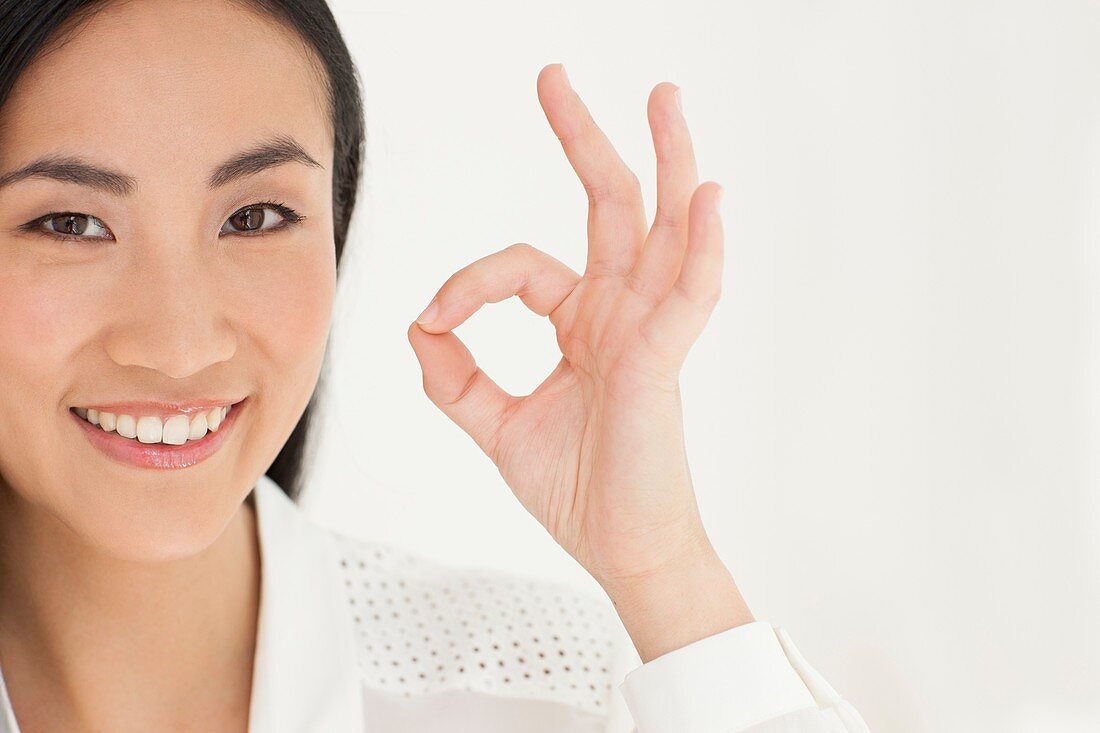 Woman making ok sign