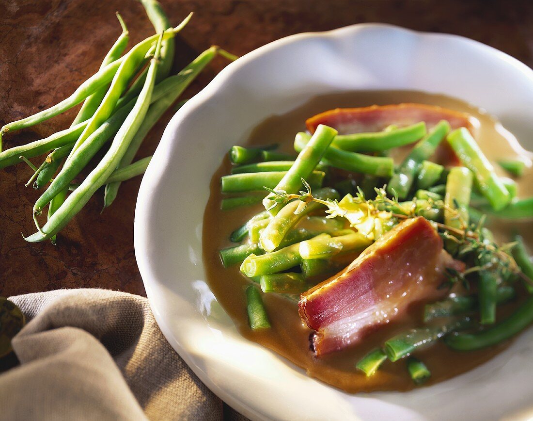 Green beans with smoked pork on plate