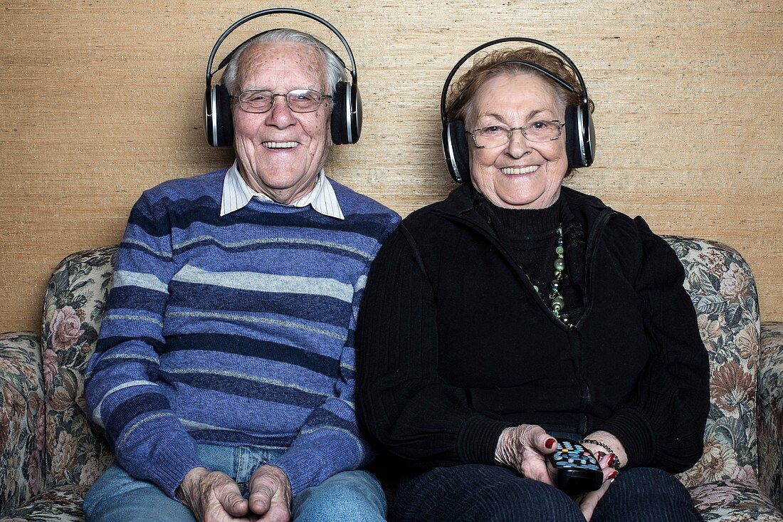 Senior couple wearing headphones