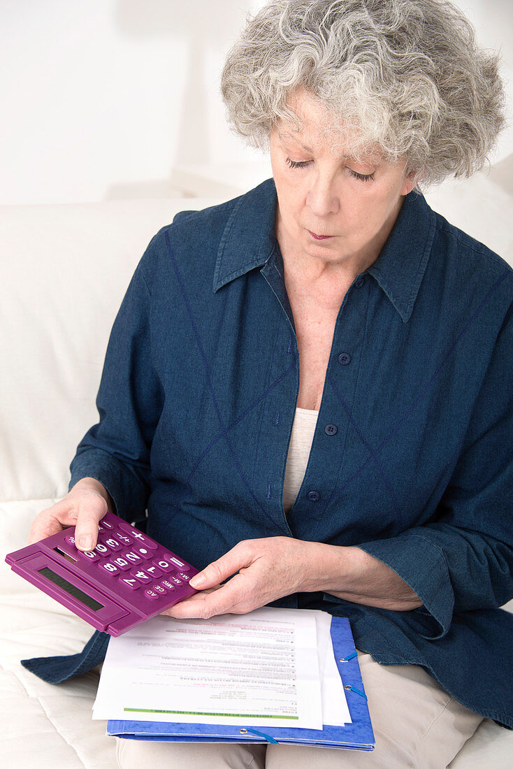Woman using calculator