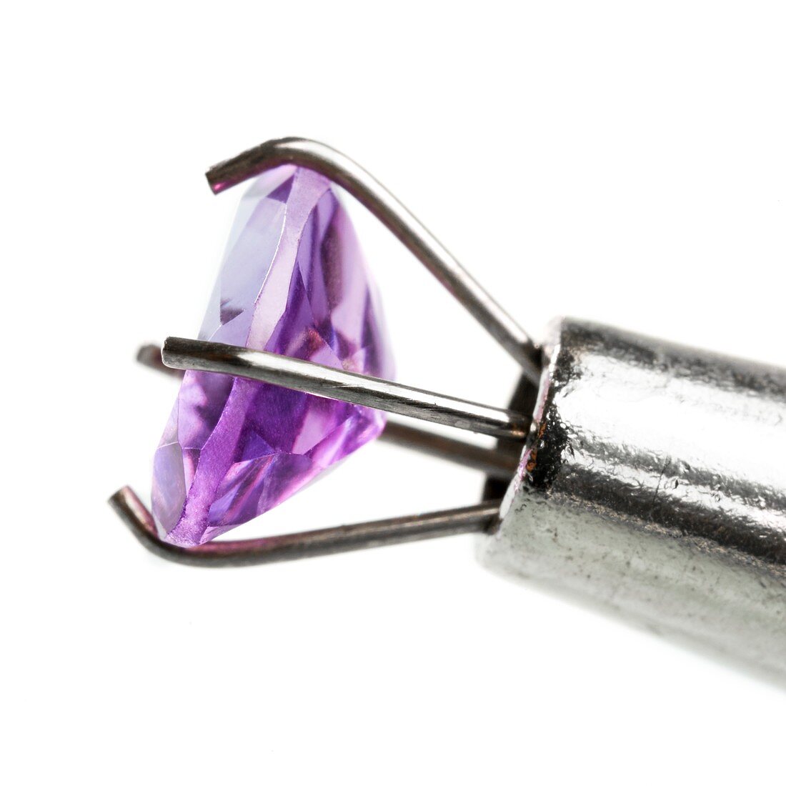 Tool holding amethyst gemstone