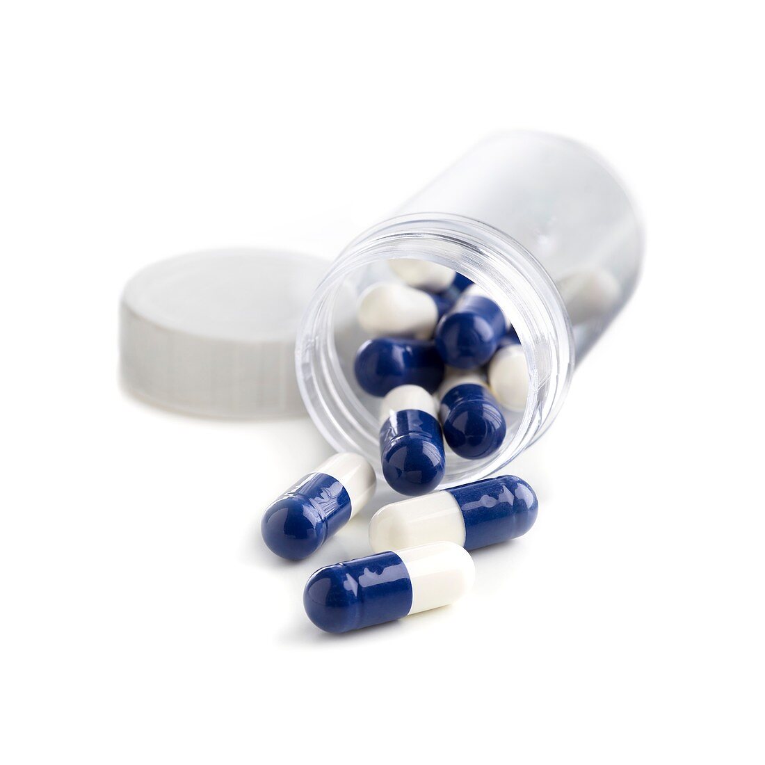 Blue and white capsules in a container