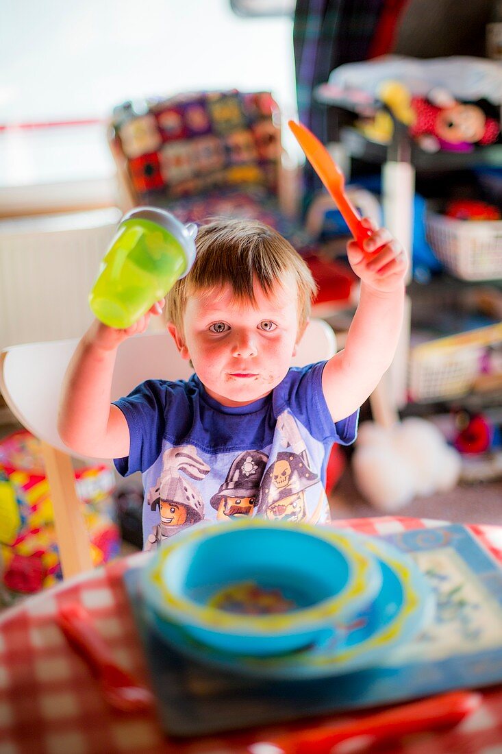 Young boy at the dinner table