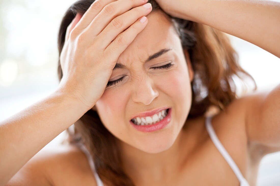 Woman with hands in hair