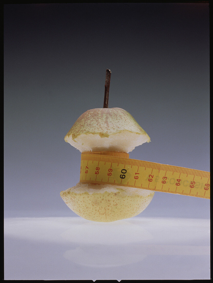 Food research: tape measuring half-eaten pear
