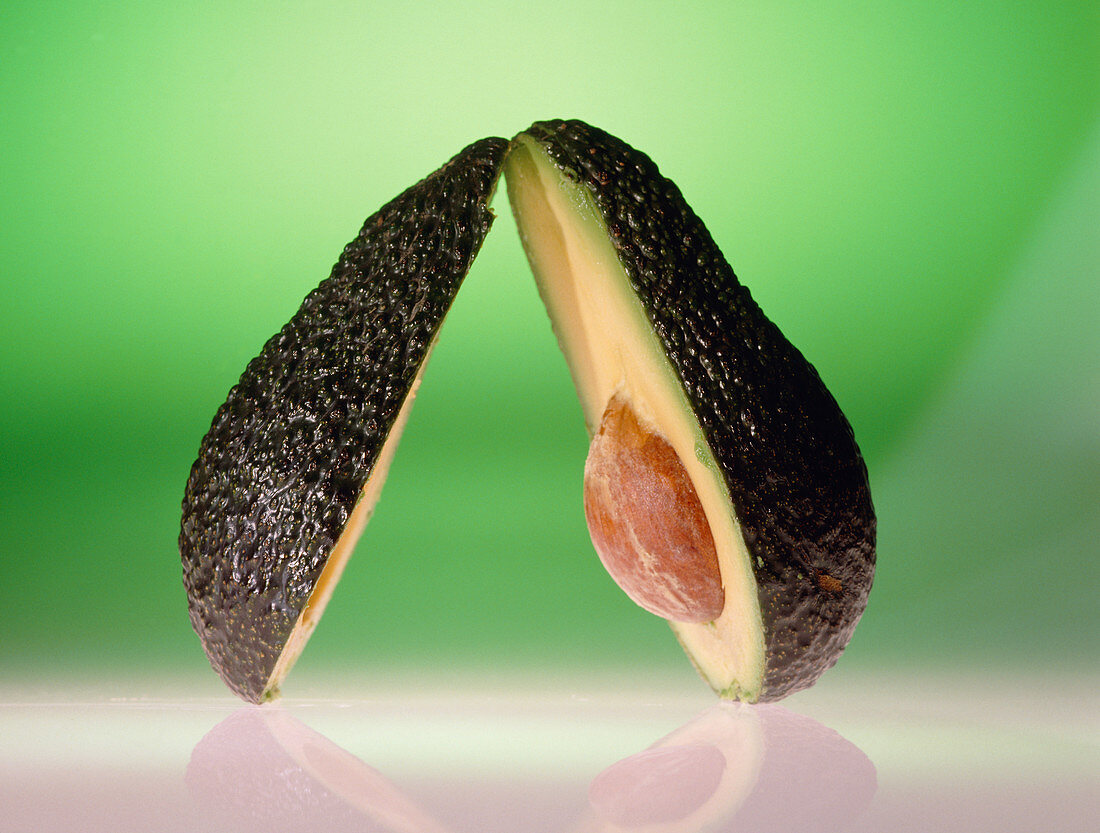 Avocado pear,cut in half to reveal stone