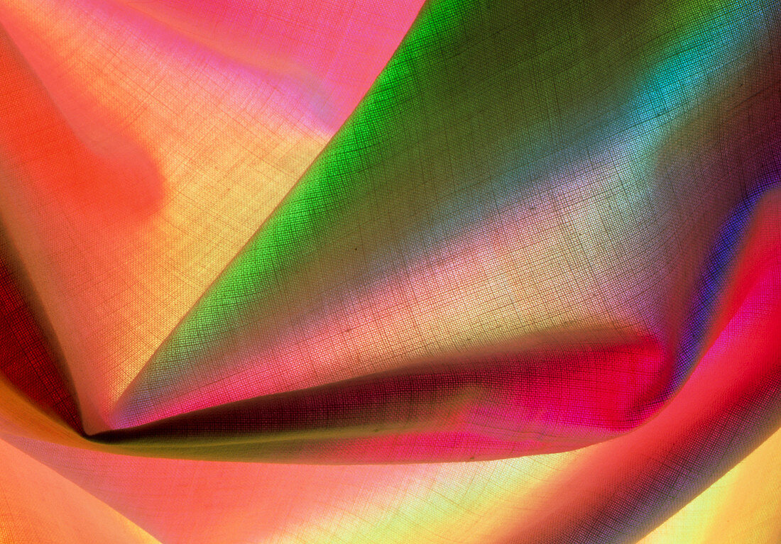 Close-up of linen cloth under coloured lights