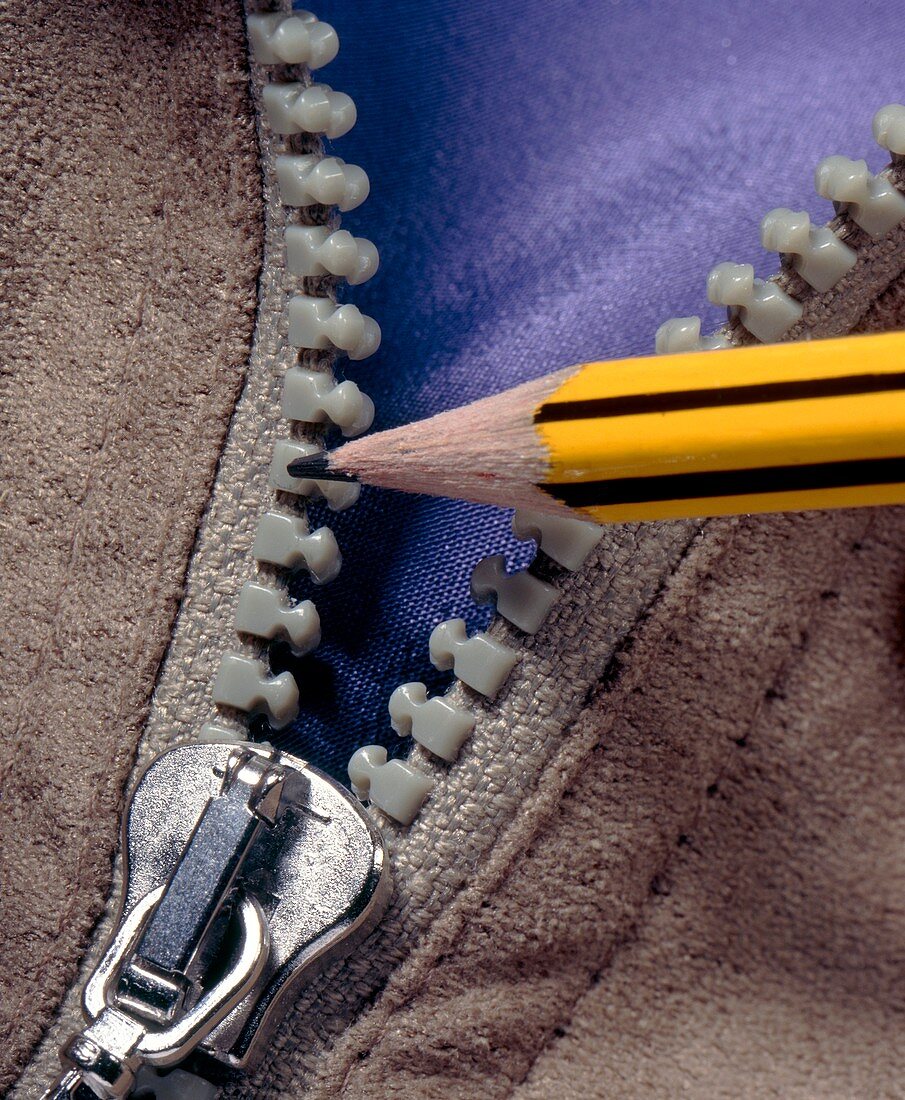 Zip fastener being lubricated with a pencil