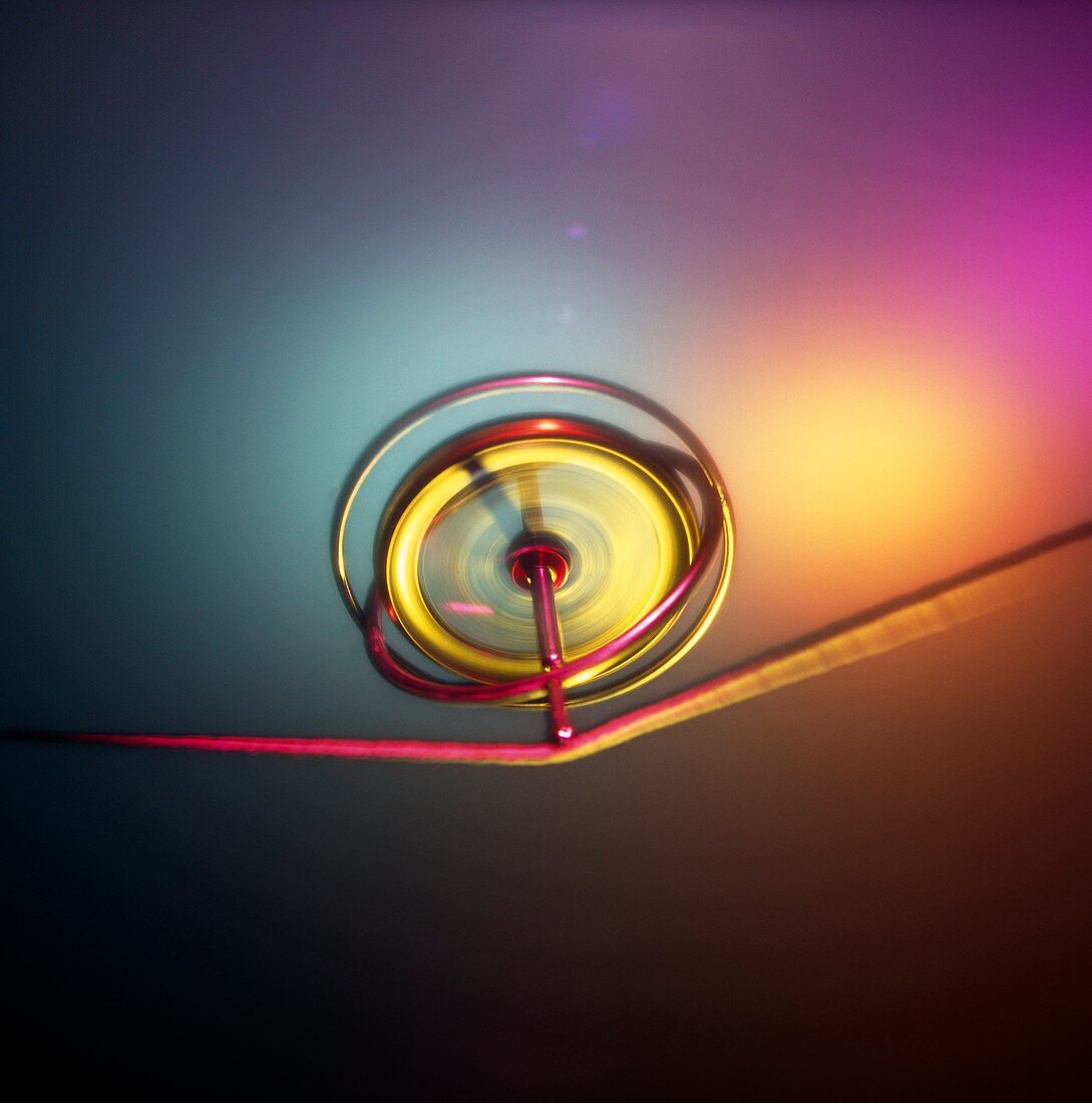 Gyroscope spinning on a piece of string