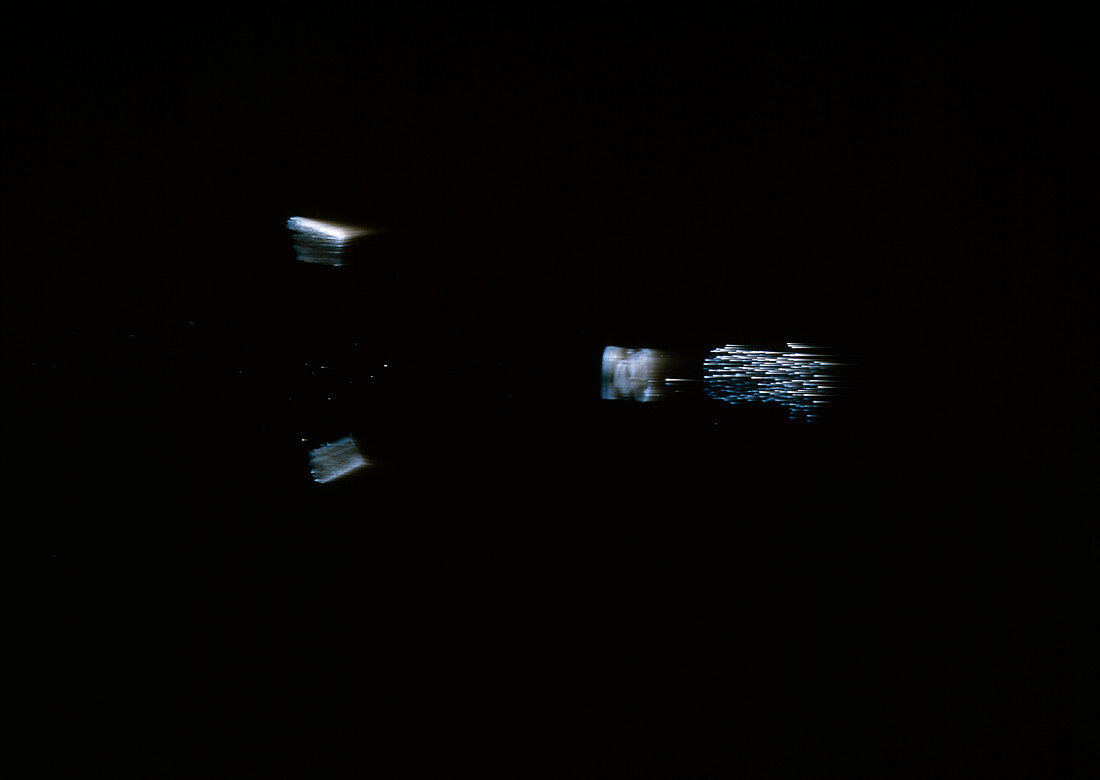 High speed photograph of bullet leaving gun