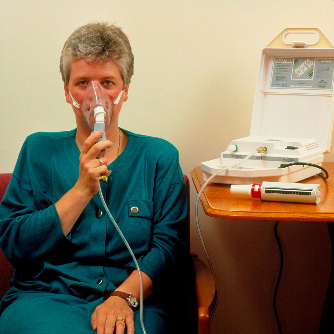 Asthma sufferer using nebulizer