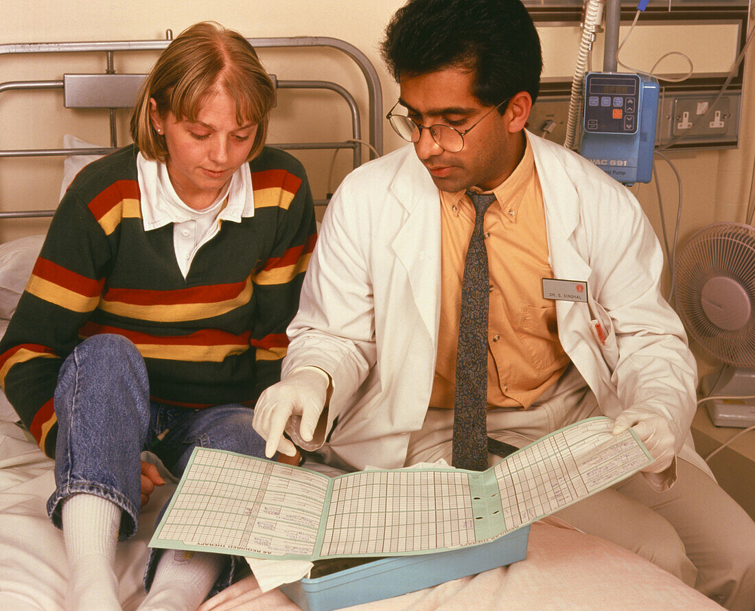 Doctor & a patient affected by myeloid leukaemia