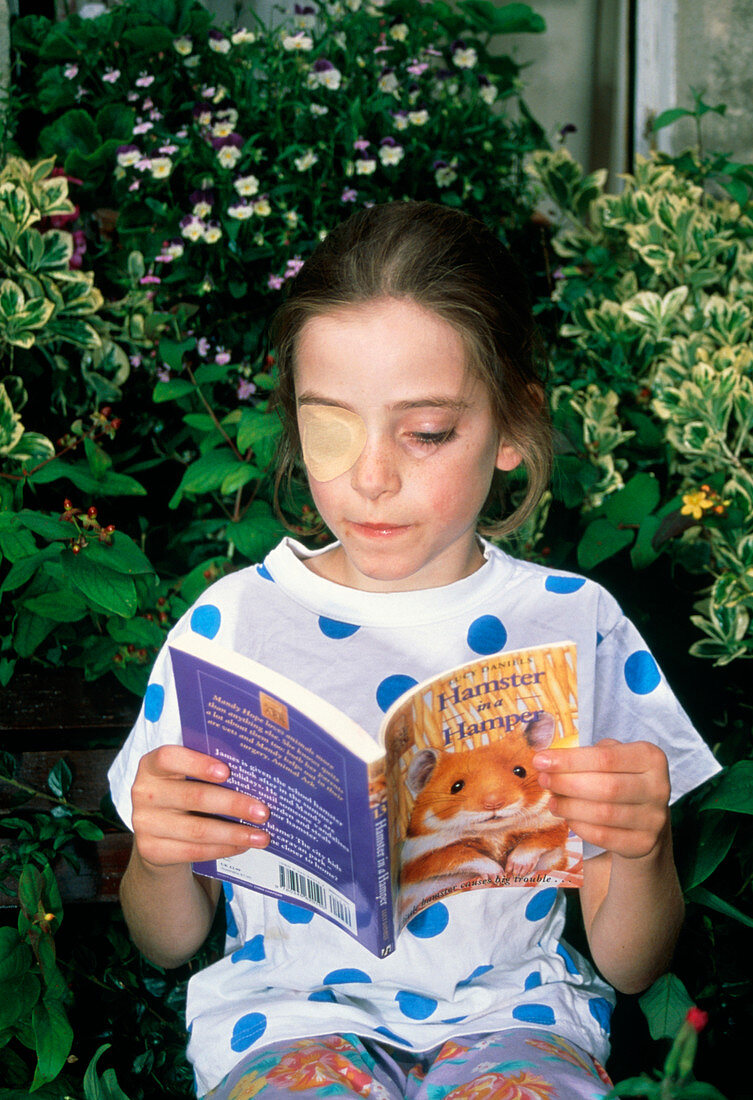 Girl,aged 8,wearing eye patch to treat lazy eye