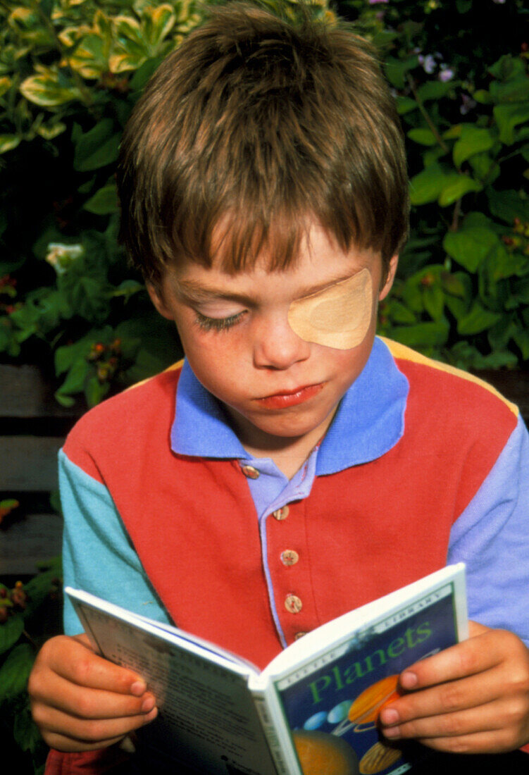 Boy,aged 6,wearing eye patch to treat lazy eye
