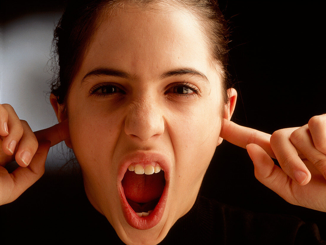 Angry teenage girl refusing to listen