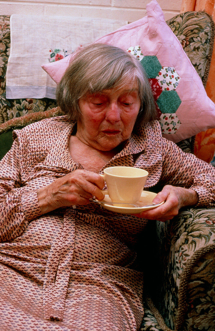 Elderly woman drinking a cup of tea