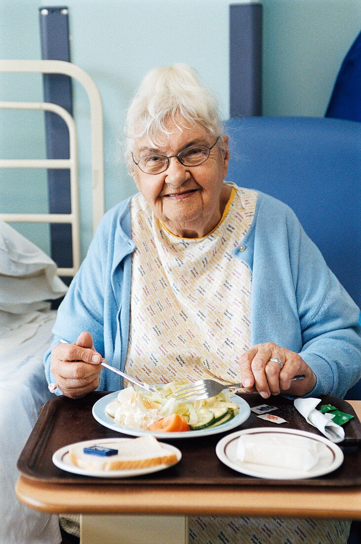 Elderly patient eating meal