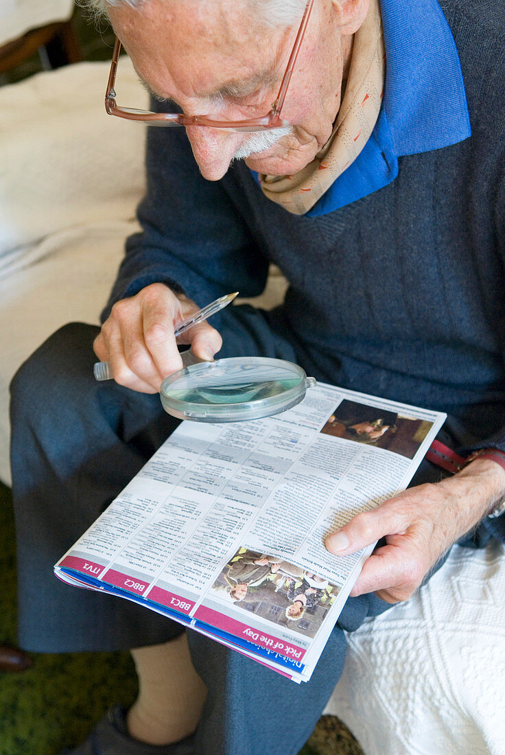 Elderly man reading