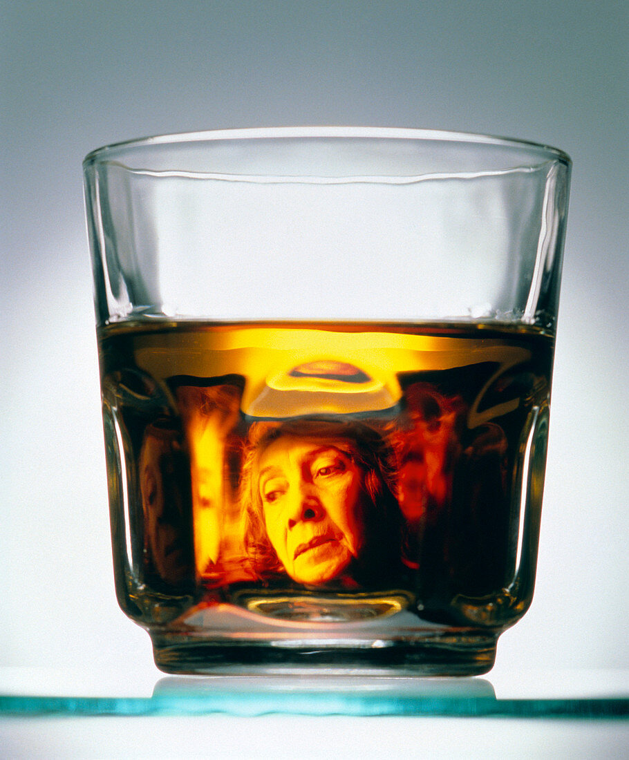 Glass of alcohol with image of alcoholic woman