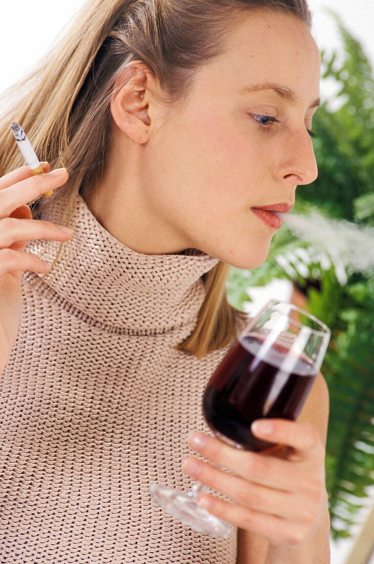 Woman smoking and drinking