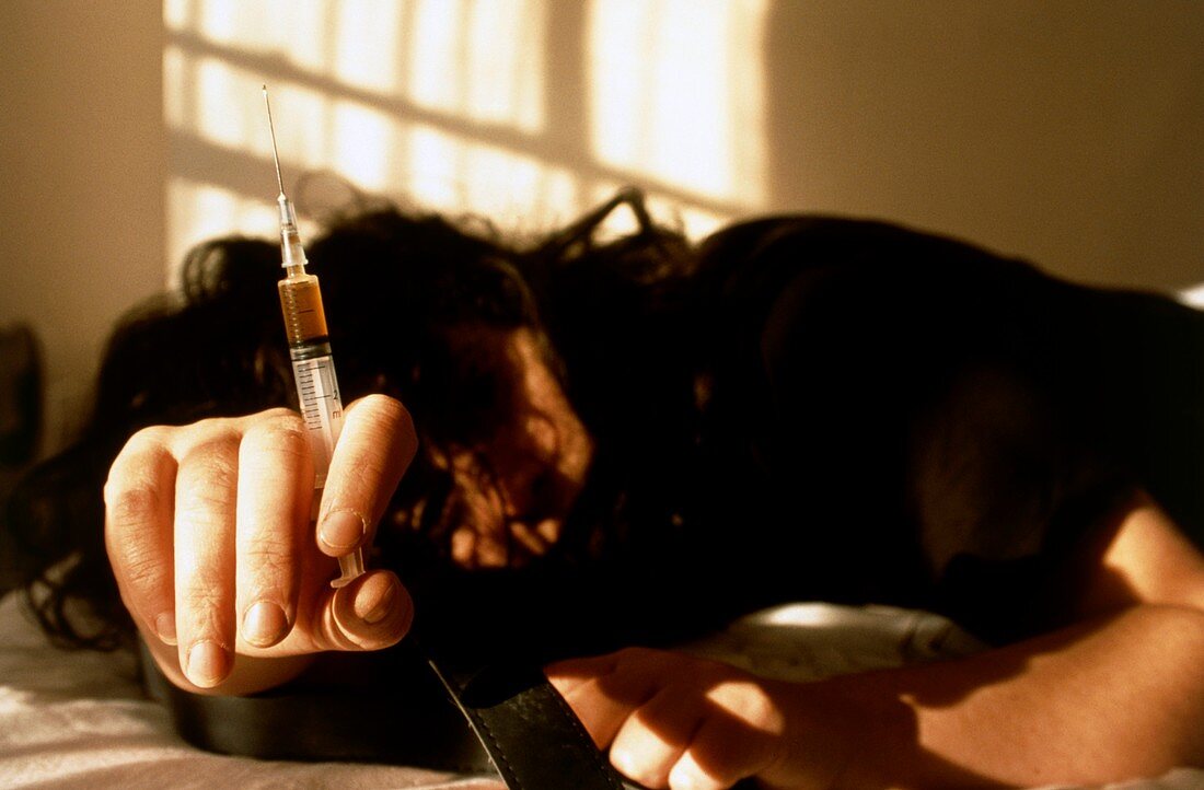 Heroin user slumped after injecting the drug