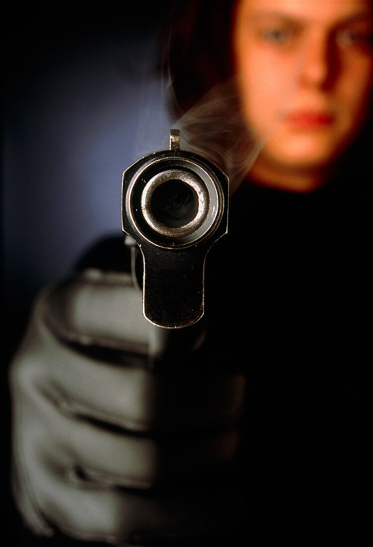 A person holding a smoking gun