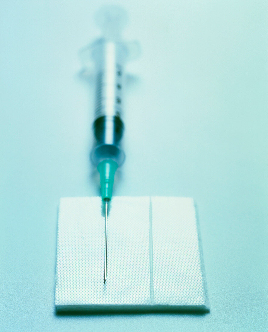 Syringe with swab