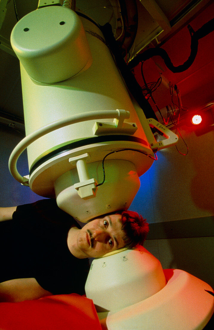 Man having magnetoencephalography (MEG) brain scan