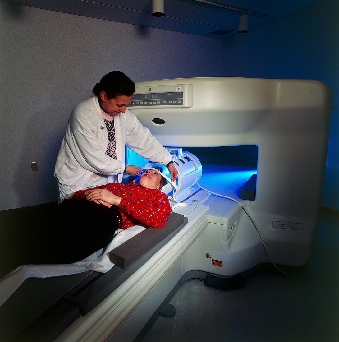 Woman prepared for entering a wide MRI scanner