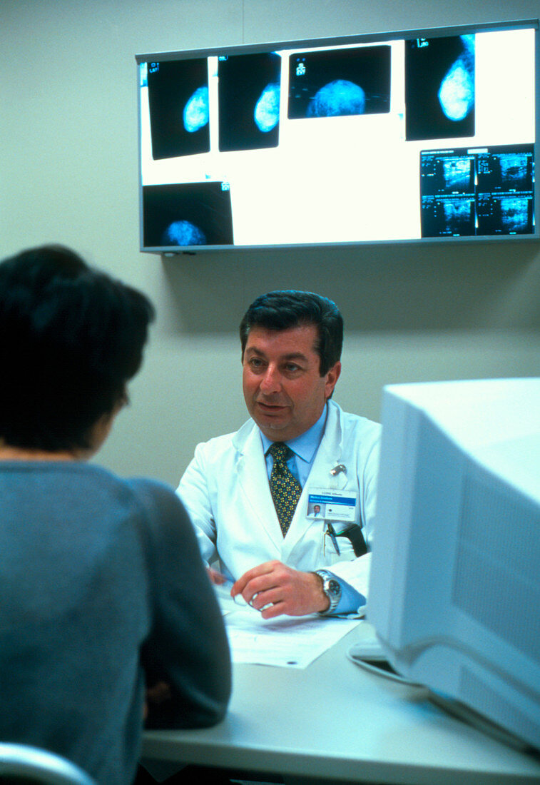 Doctor discussing mammograms with female patient