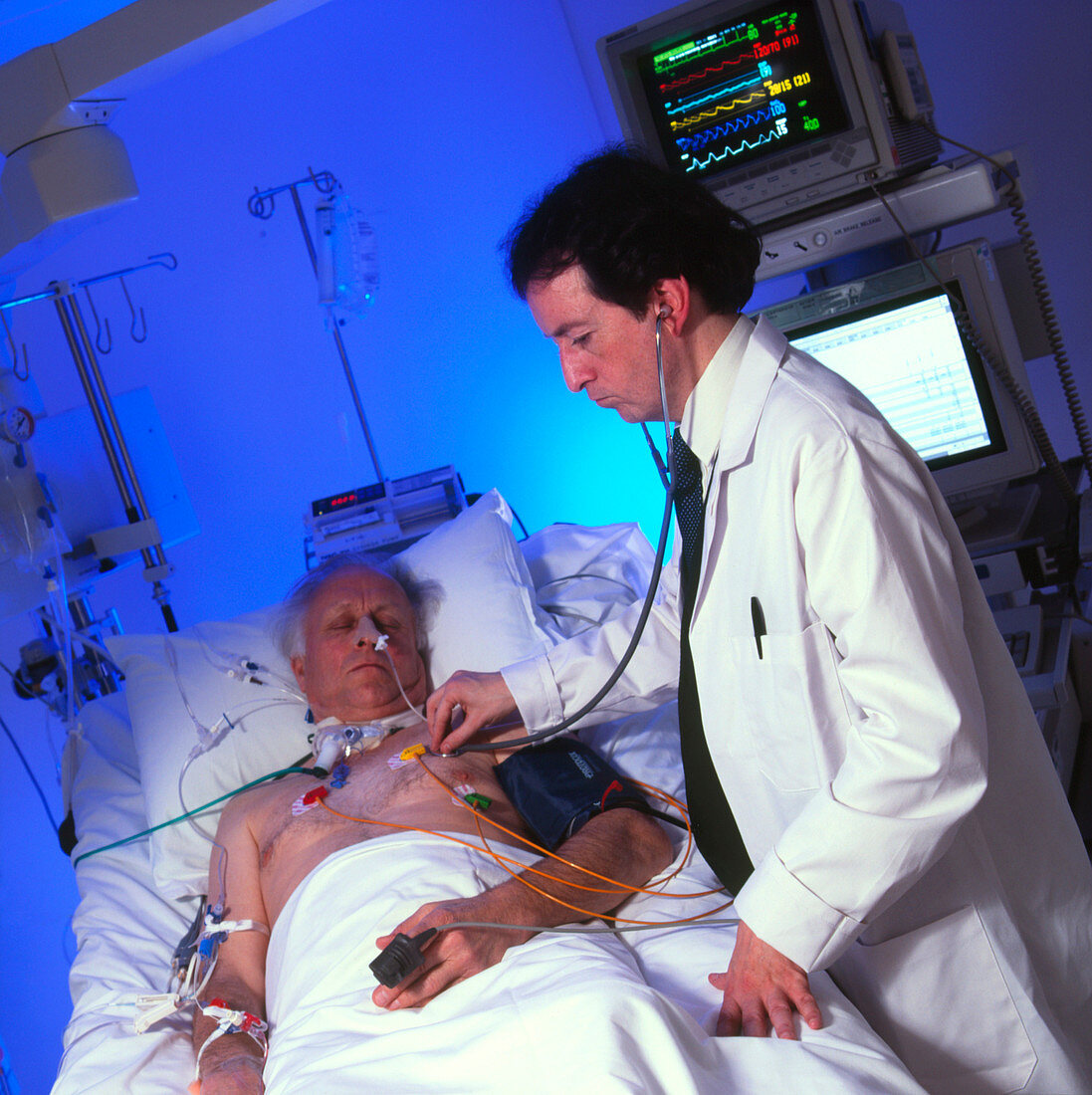 Doctor with an elderly patient in intensive care