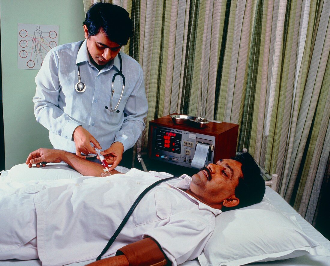 Doctor taking blood sample during drug trial